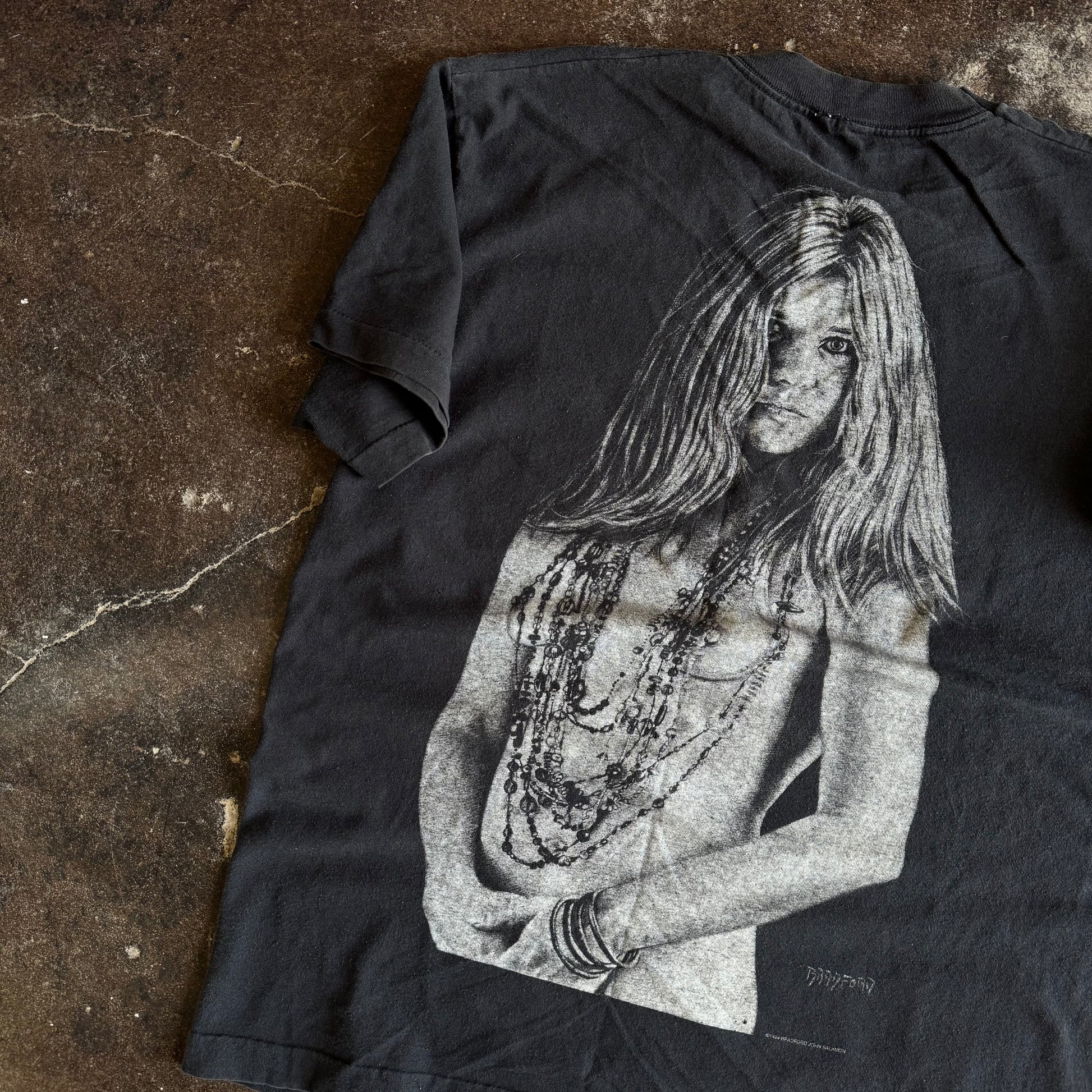 Detail of Janis Joplin portrait with necklaces on vintage Bradford Gallery tee