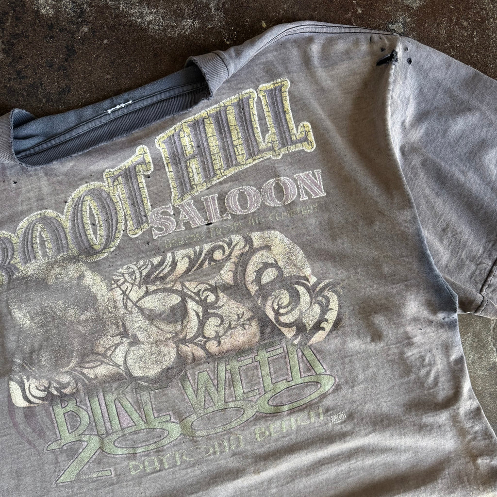 Tag detail on vintage Y2K Boot Hill Saloon Bike Week sun faded tee