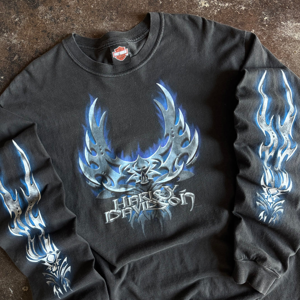 Detail of blue chrome blade flames and skull on vintage Harley longsleeve