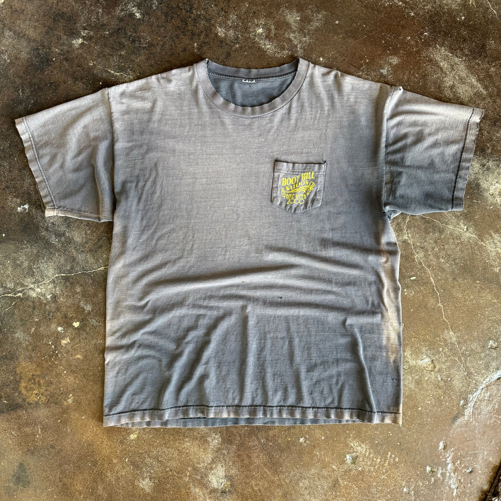 Detail of Boot Hill Saloon pinup graphic on vintage sun faded Bike Week tee