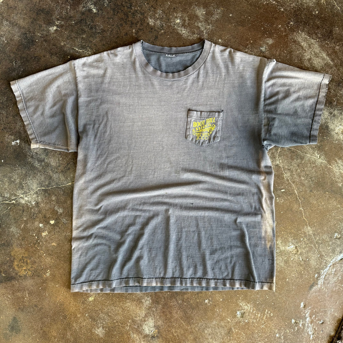 Detail of Boot Hill Saloon pinup graphic on vintage sun faded Bike Week tee