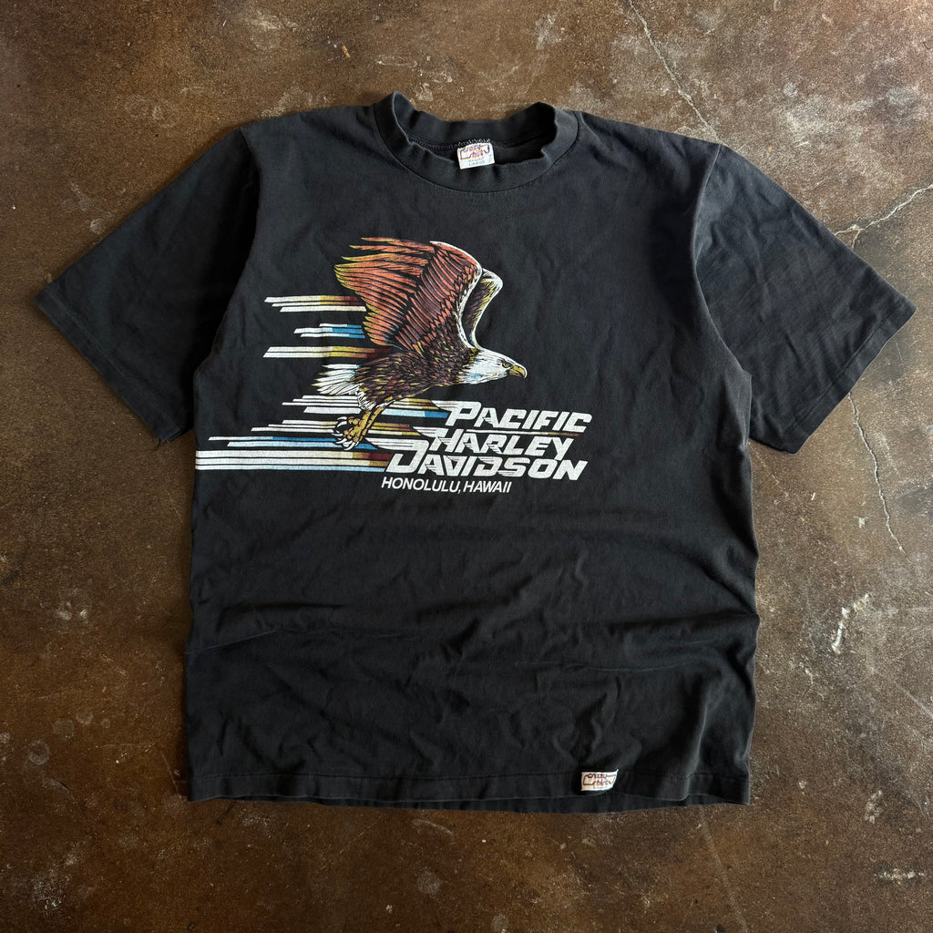 Vintage 1980s Pacific Harley Davidson Honolulu Hawaii t-shirt with swooping eagle graphic by Crazy Shirts on faded black