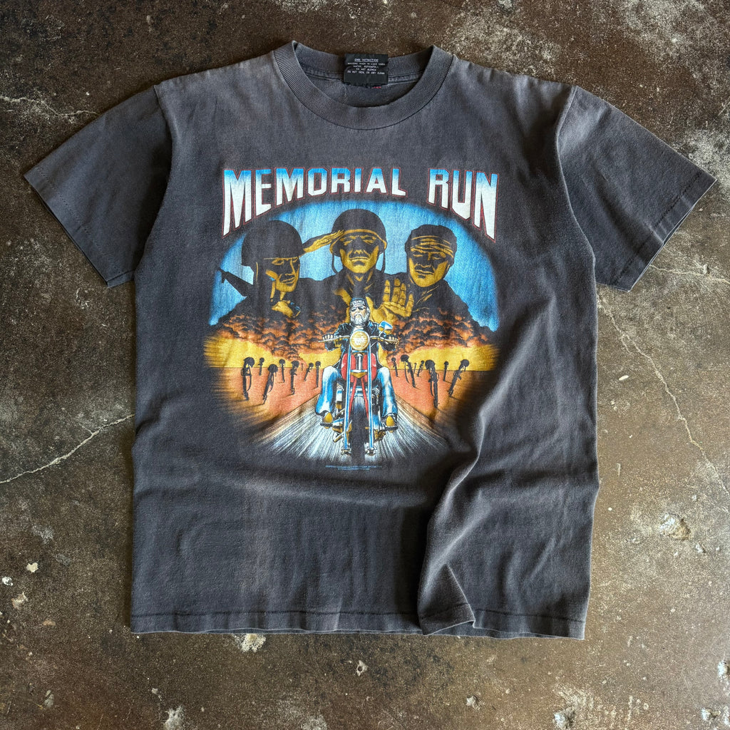 Vintage 1990s Biker Memorial Run t-shirt with military soldiers and chopper rider among crosses on sun faded charcoal