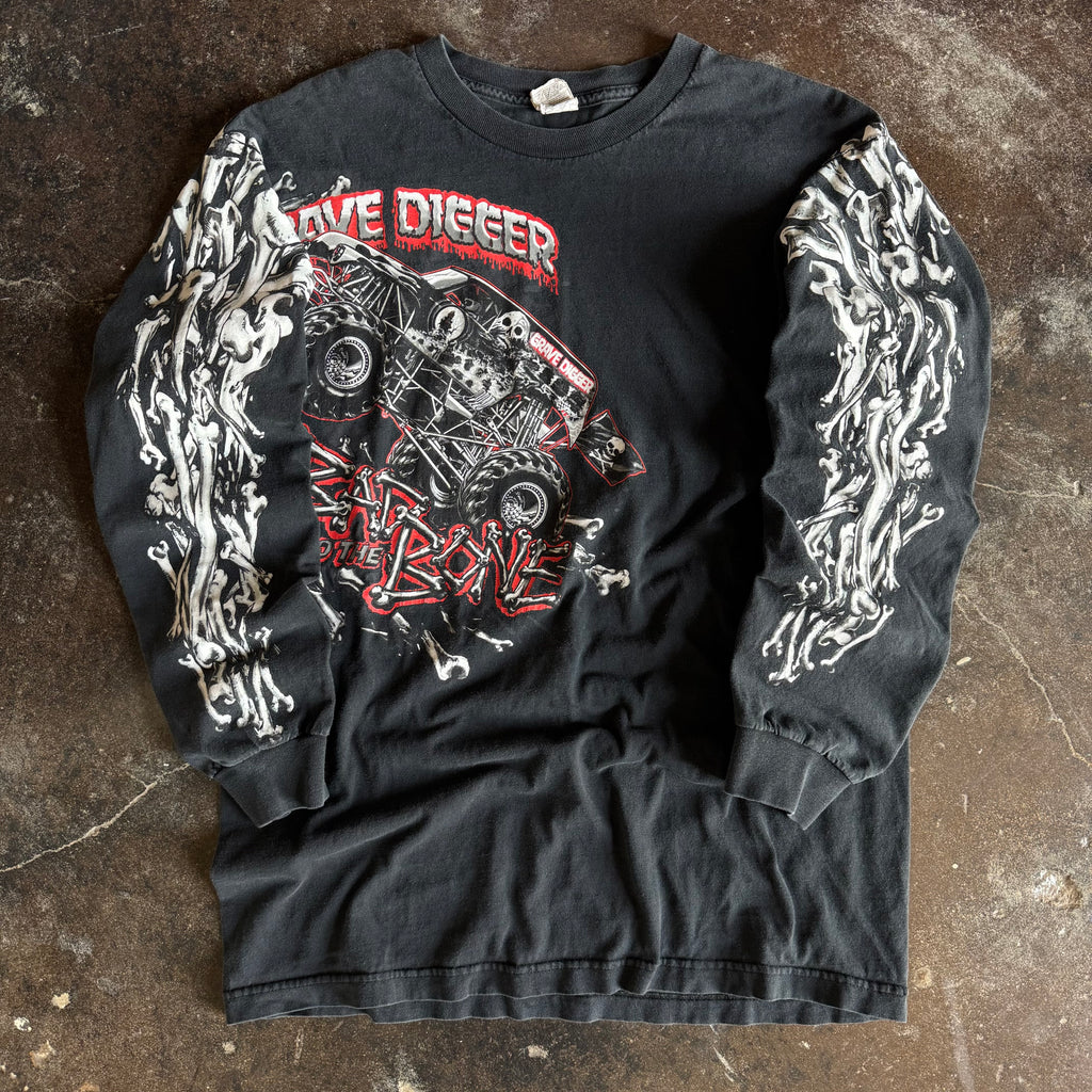 Vintage Y2K Grave Digger skull pile longsleeve t-shirt with skull graphics on black