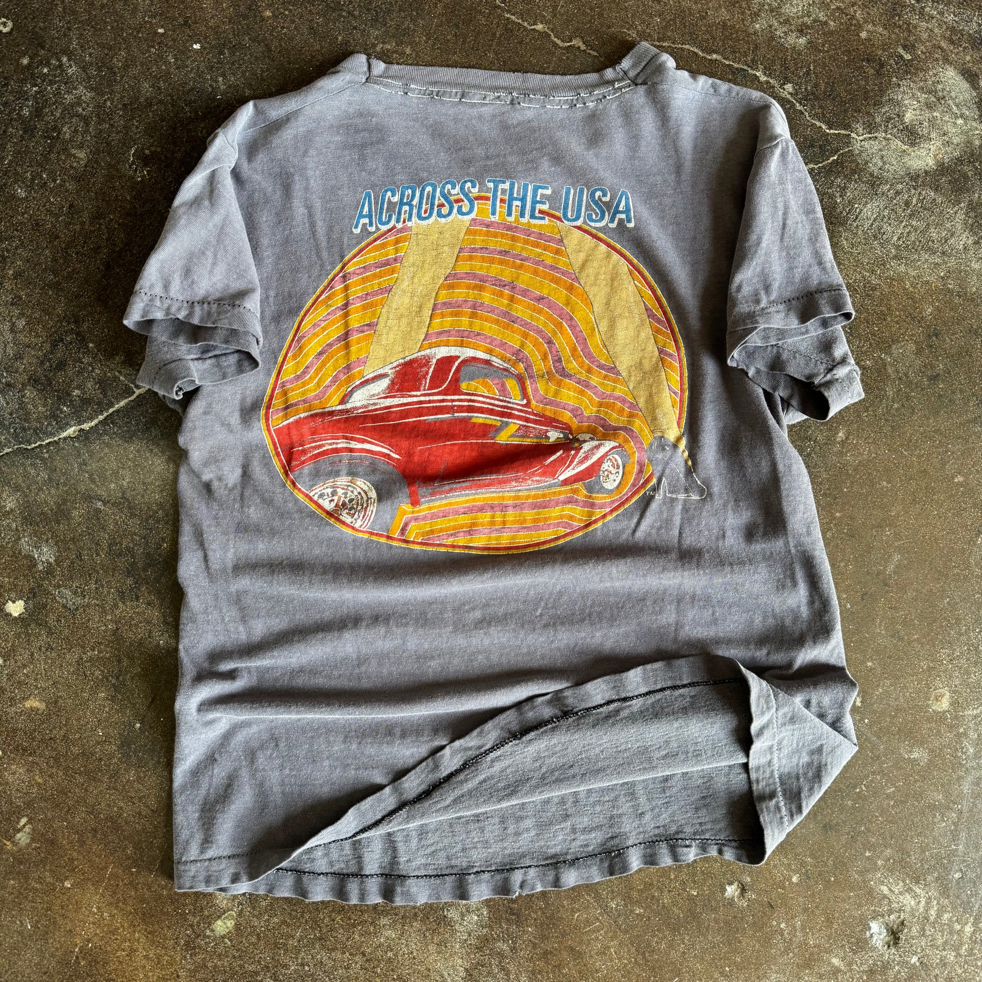 Detail of ZZ Top logo and Eliminator hot rod on vintage sun faded band tee