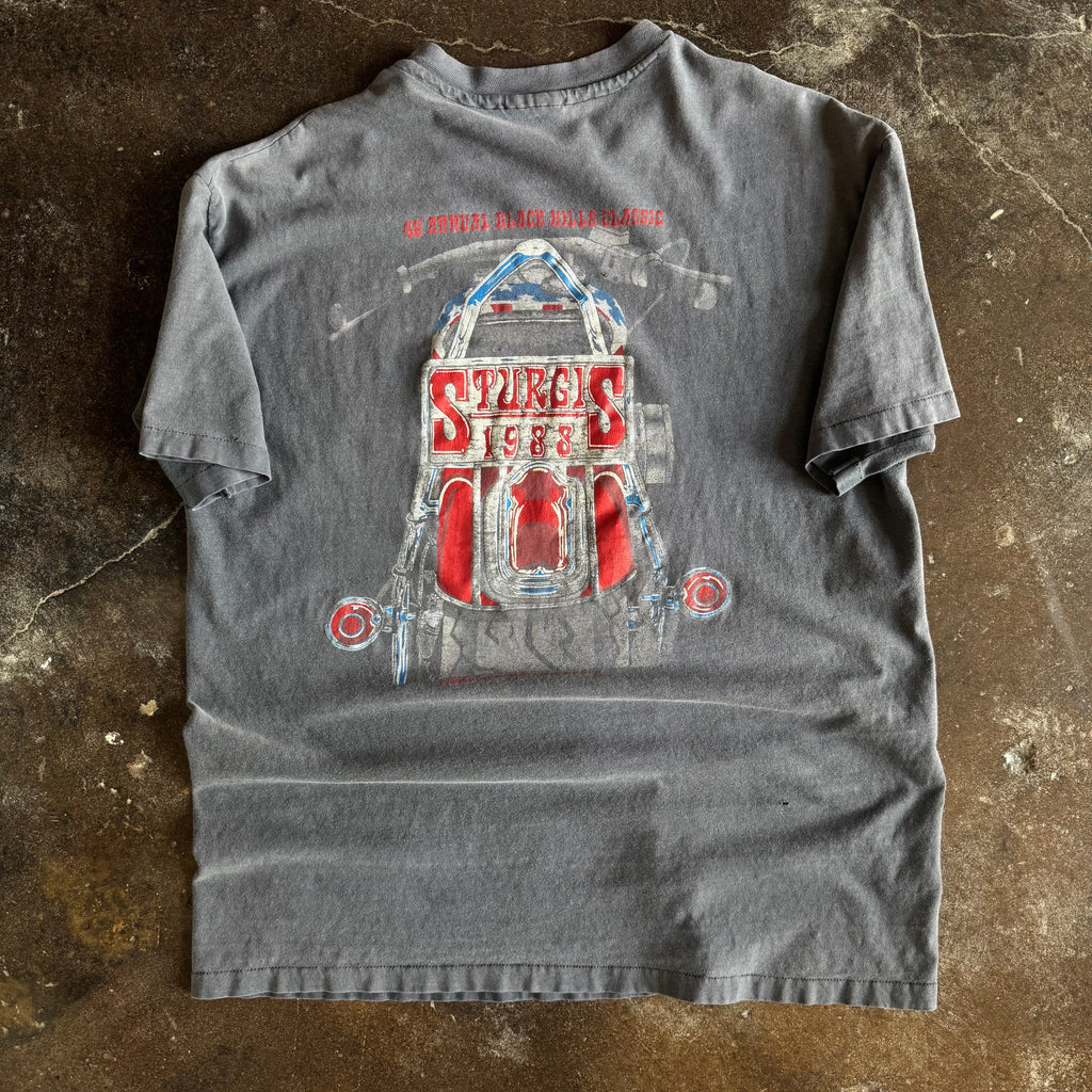 Detail of Mount Rushmore biker faces and Sturgis 88 graphic on vintage sun faded tee