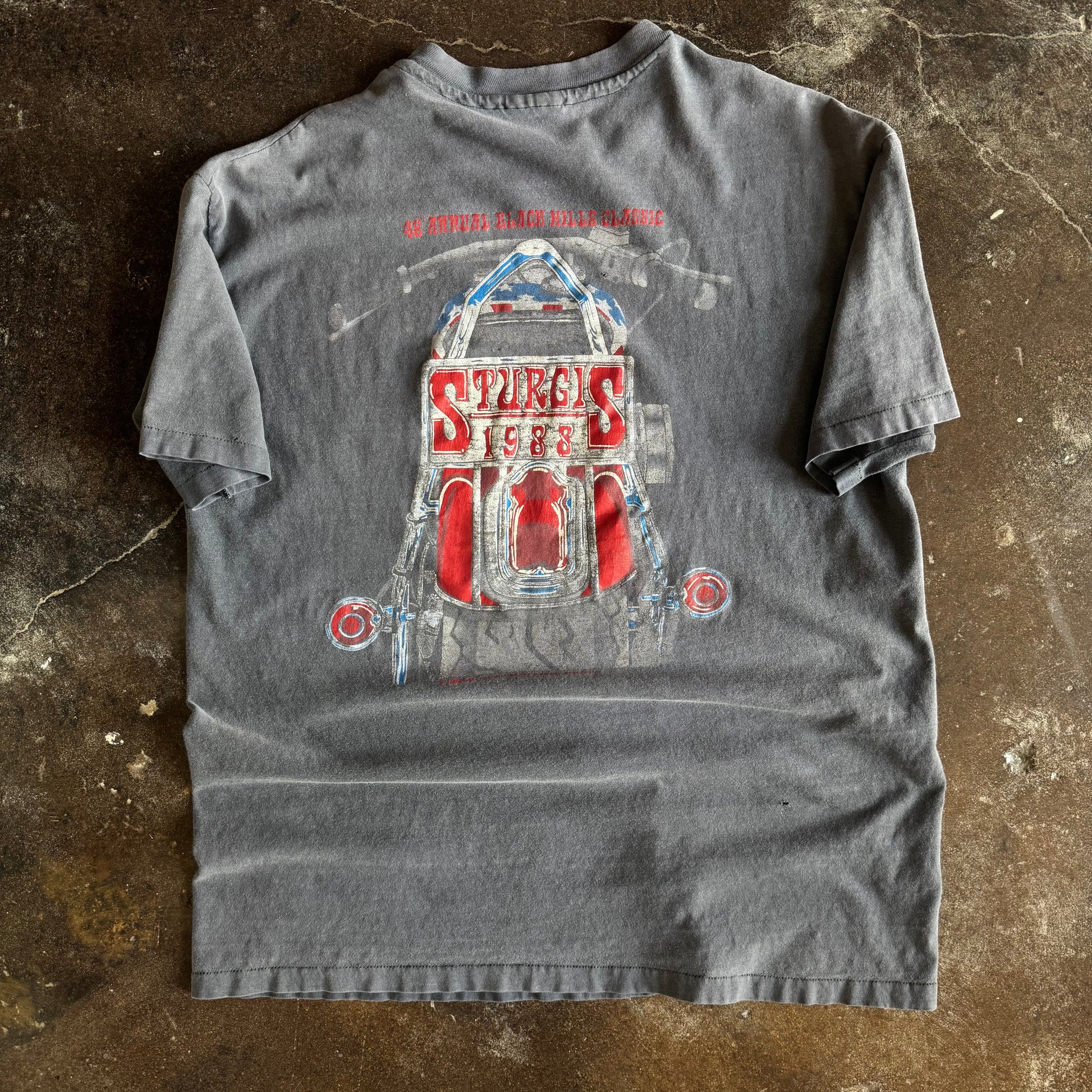 Detail of Mount Rushmore biker faces and Sturgis 88 graphic on vintage sun faded tee