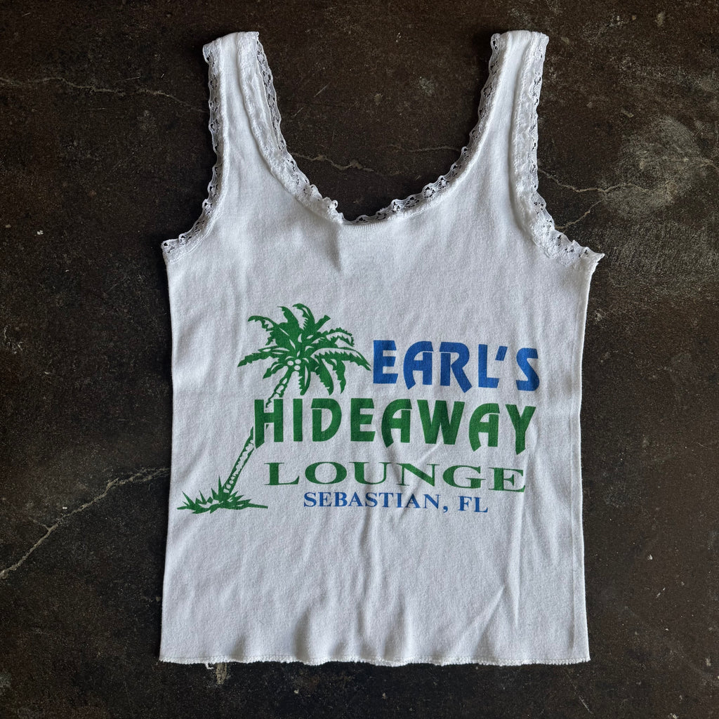 Detail of feather and Harley Davidson script on vintage womens white lace tank