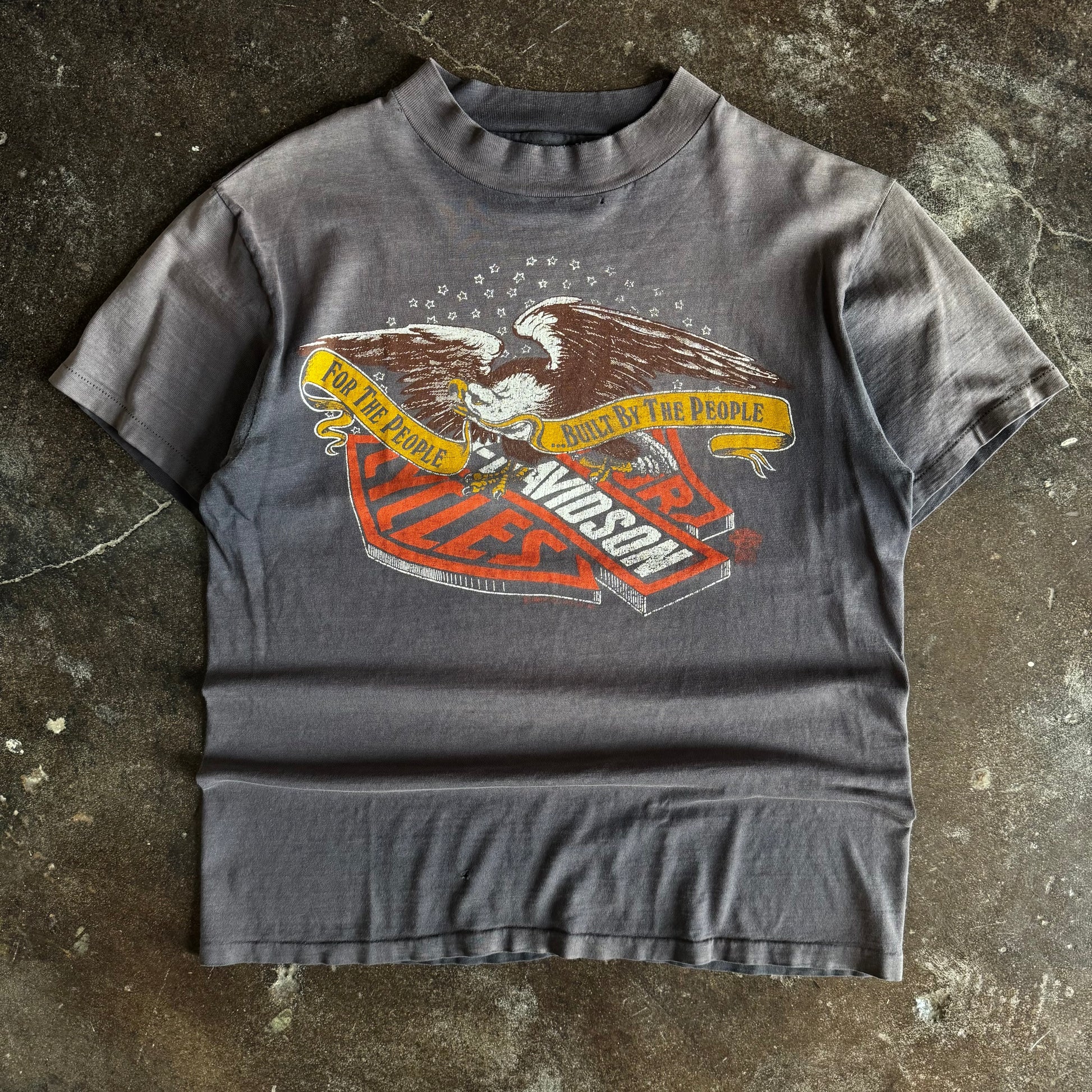 Black short-sleeve t-shirt with eagle graphic and For the People Harley text, sun faded